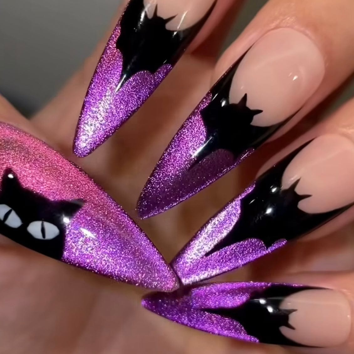 Purple cat eye nails with Bat Nail designs and magnetic technology for a spooky and stylish Halloween look.