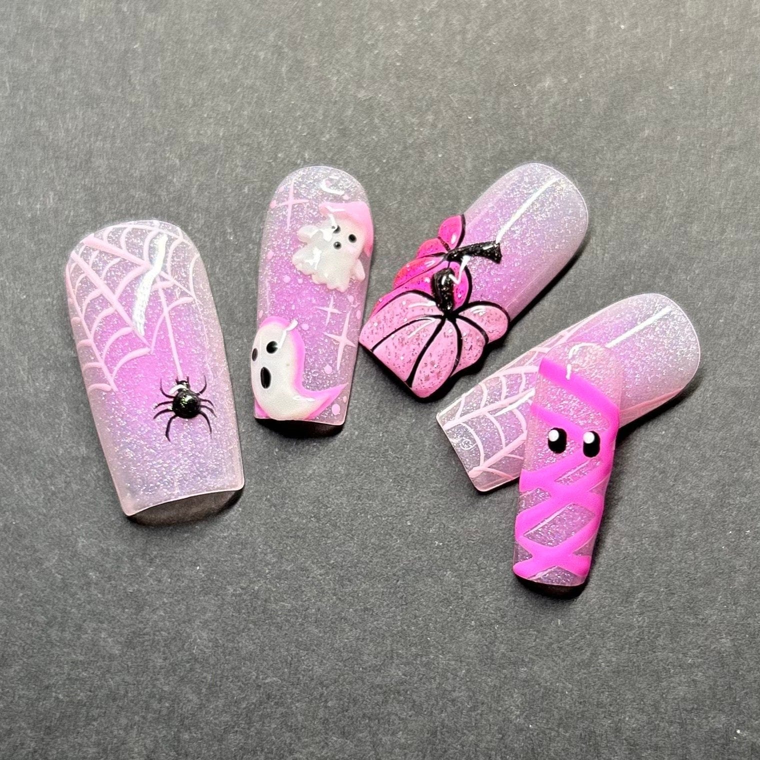 Cute ghost nails featuring ghost face nail designs and Halloween cute nails for a festive and playful Halloween manicure.