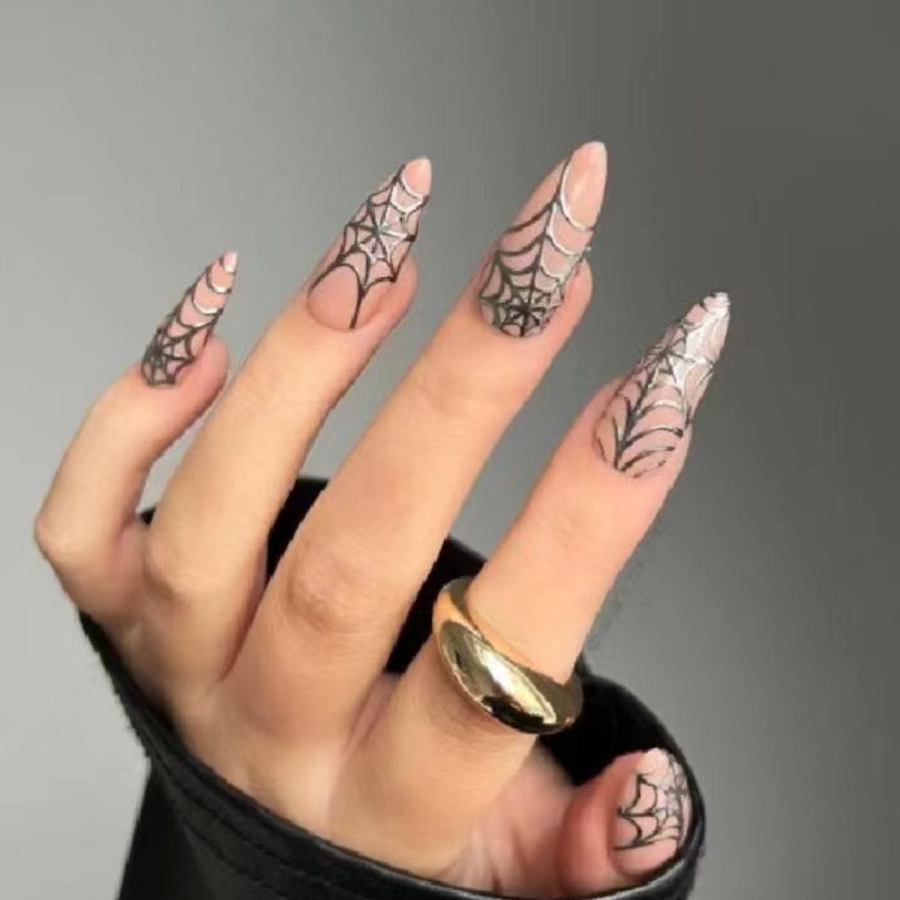 Simple spider web nails for a spooky Halloween manicure that’s easy to apply and wear.