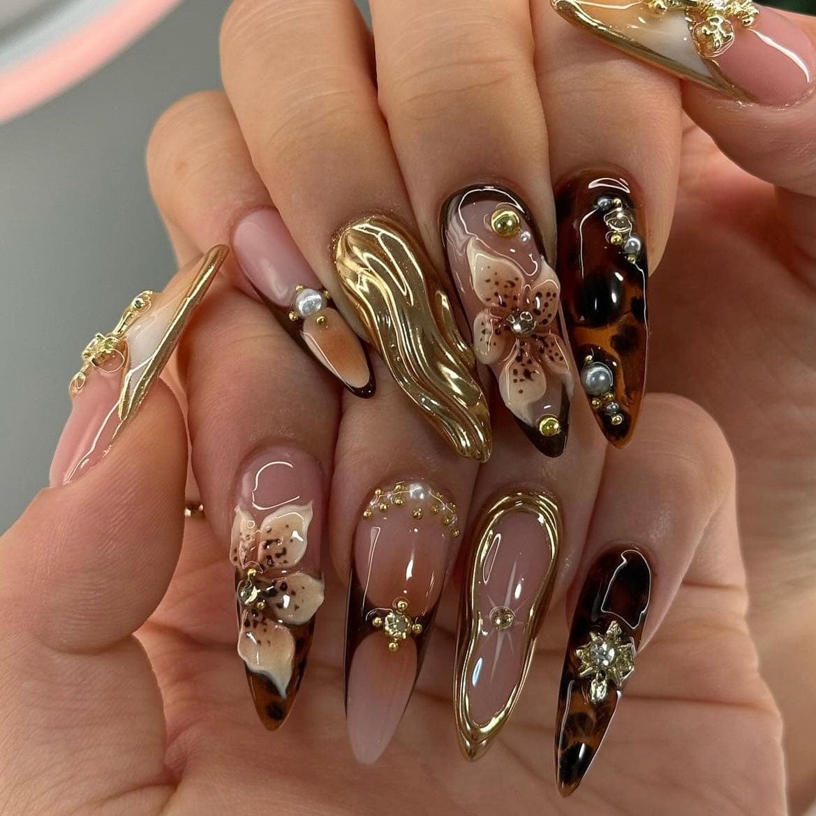 Burgundy chrome nails with a sleek, reflective finish