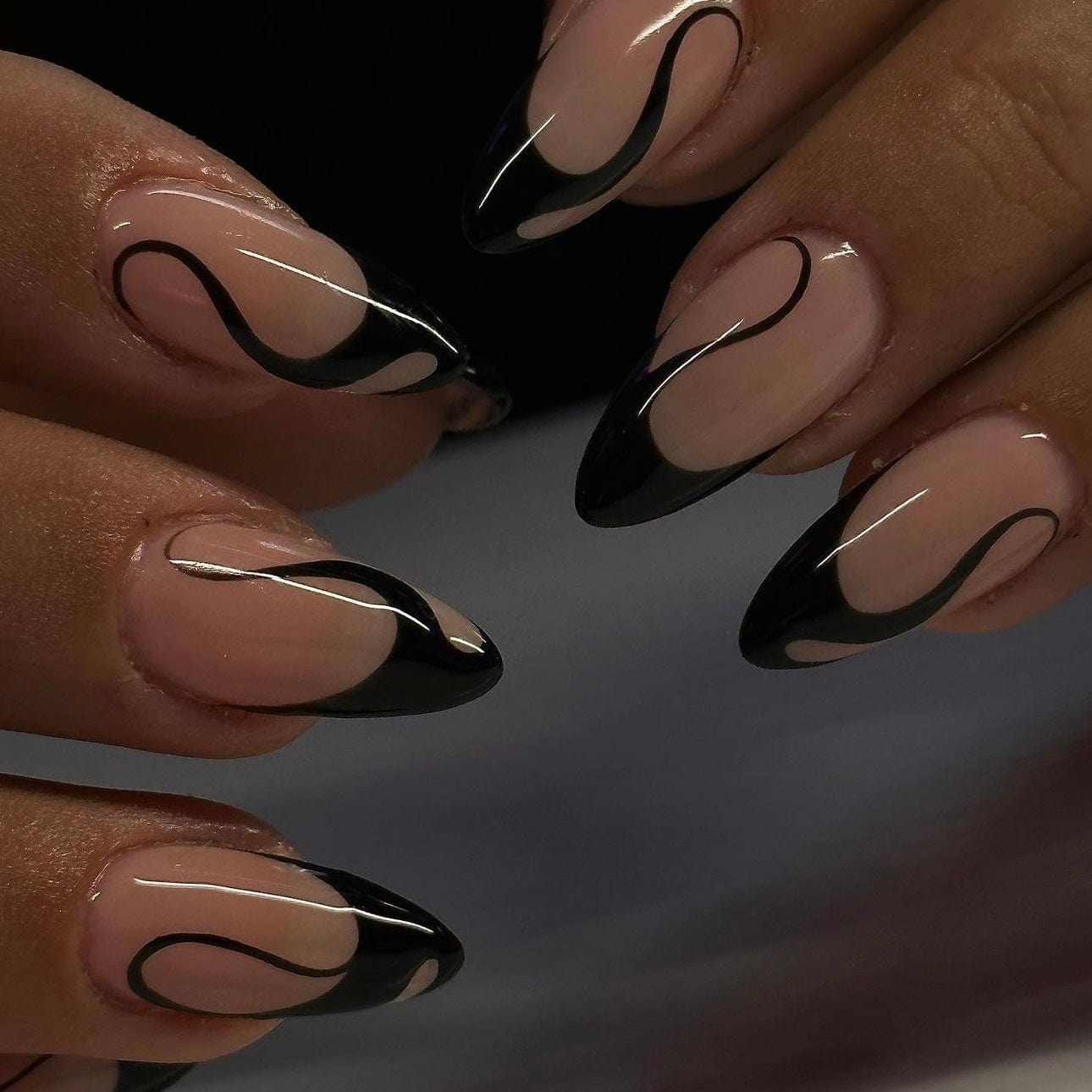 Black French tip press-on nails with elegant tips for a modern, stylish look.