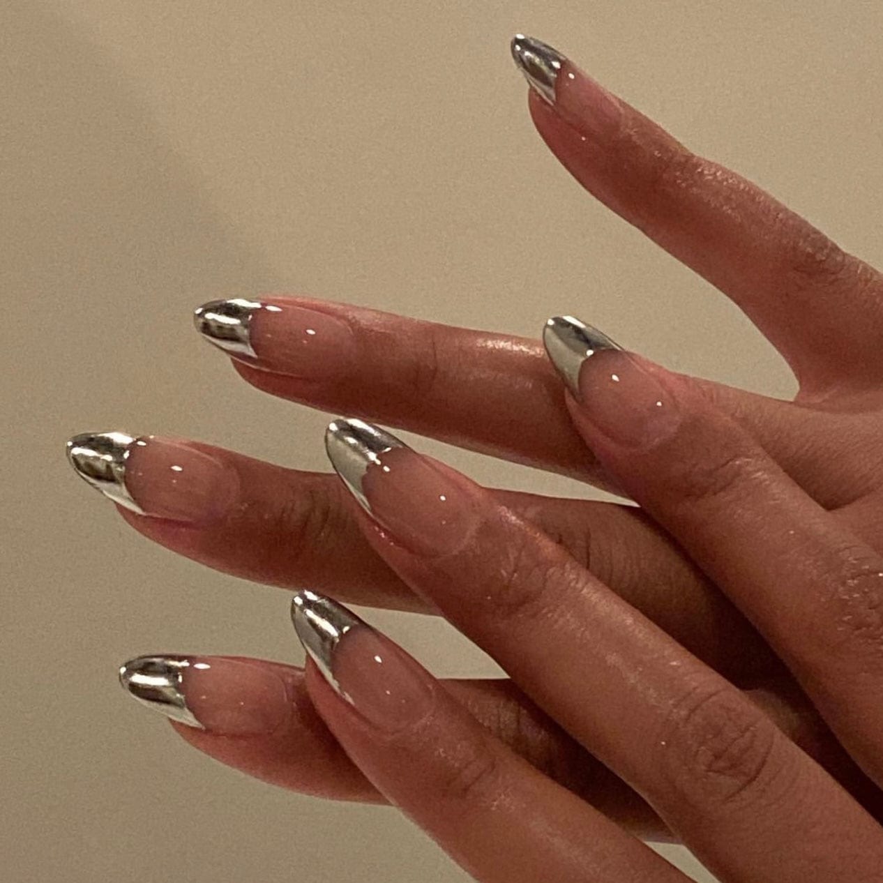 Chrome press-on nails with a sleek metallic finish for a bold and modern manicure.