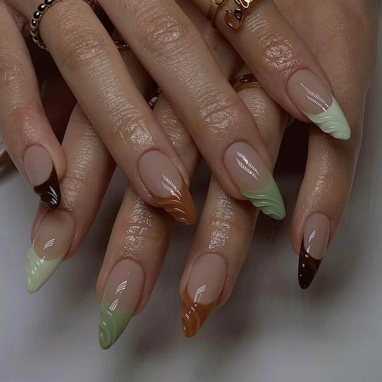 Fall green nails featuring rich shades for a chic autumn manicure.