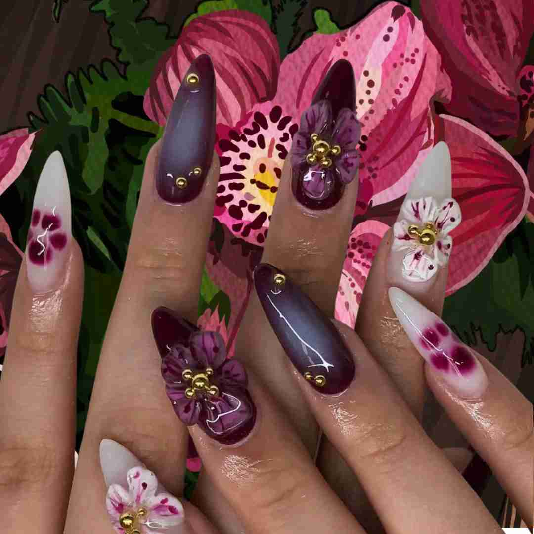 Lavender flower nails with delicate purple flower designs and encapsulated flowers for a unique and elegant manicure.