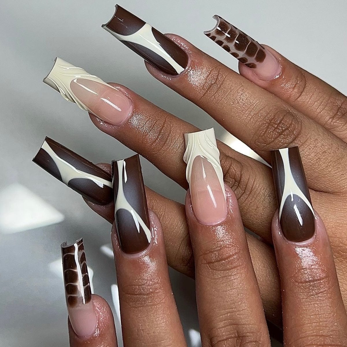 Long square nails in rich chocolate brown for a modern fall look