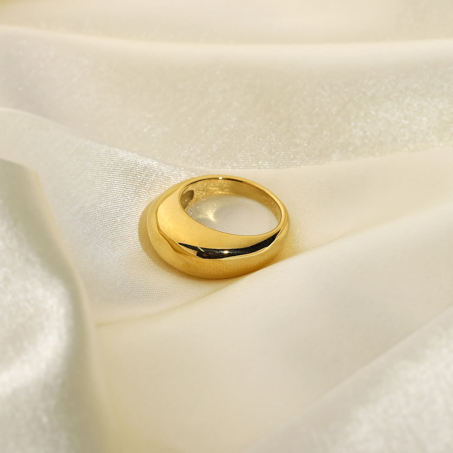 Thick gold band ring in contemporary fashion style