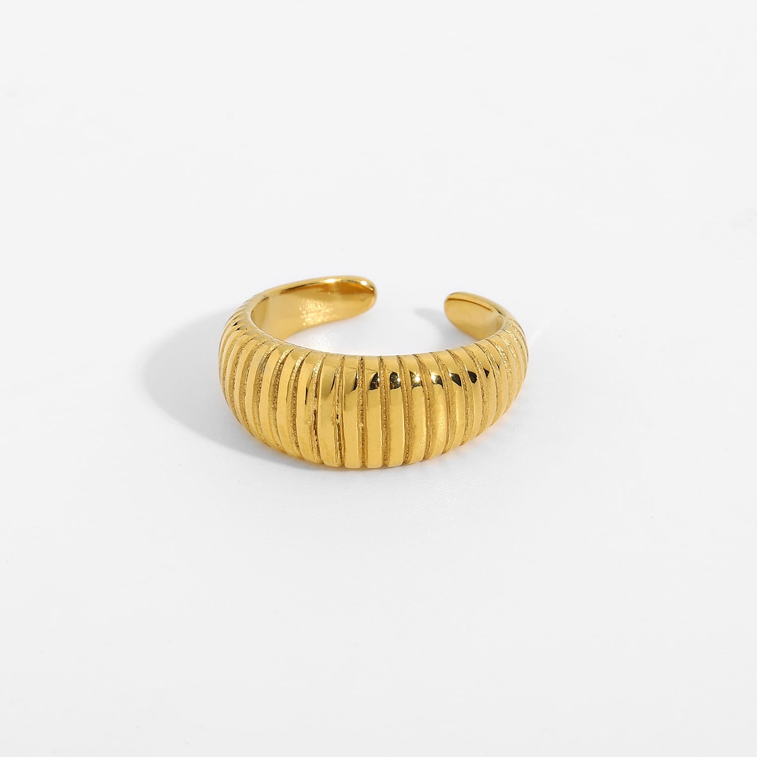 Close-up of modern chunky gold ring with thick band design