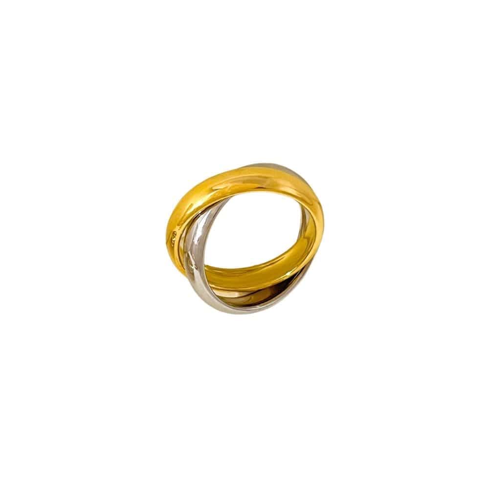 Close-up of a two-tone interwoven Trinity Ring in white and yellow metal