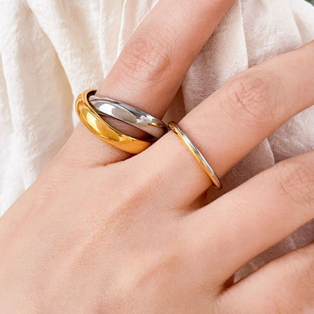 Timeless mixed-metal trinity ring symbolizing unity and love
