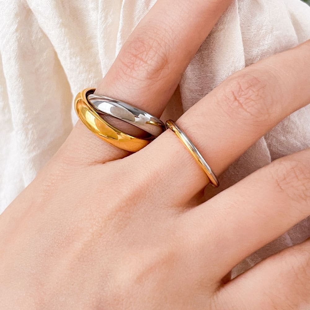 Timeless mixed-metal trinity ring symbolizing unity and love